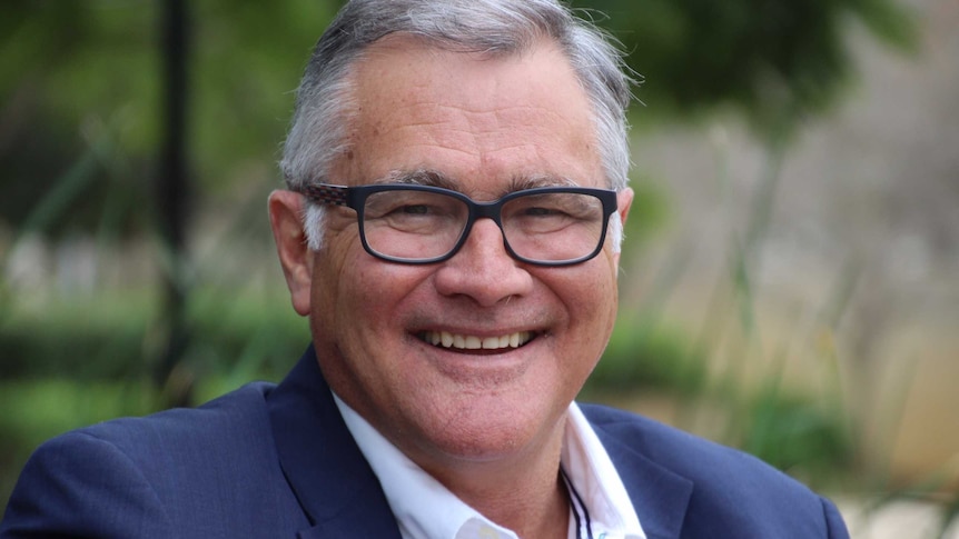 Former WA Labor Premier Geoff Gallop looks at the camera and smiles.