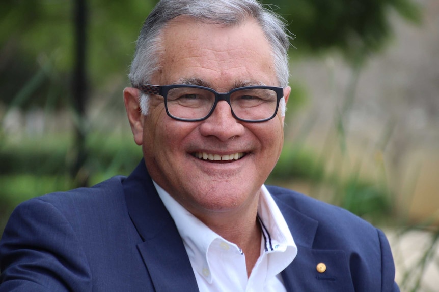 Former WA Labor Premier Geoff Gallop looks at the camera and smiles.