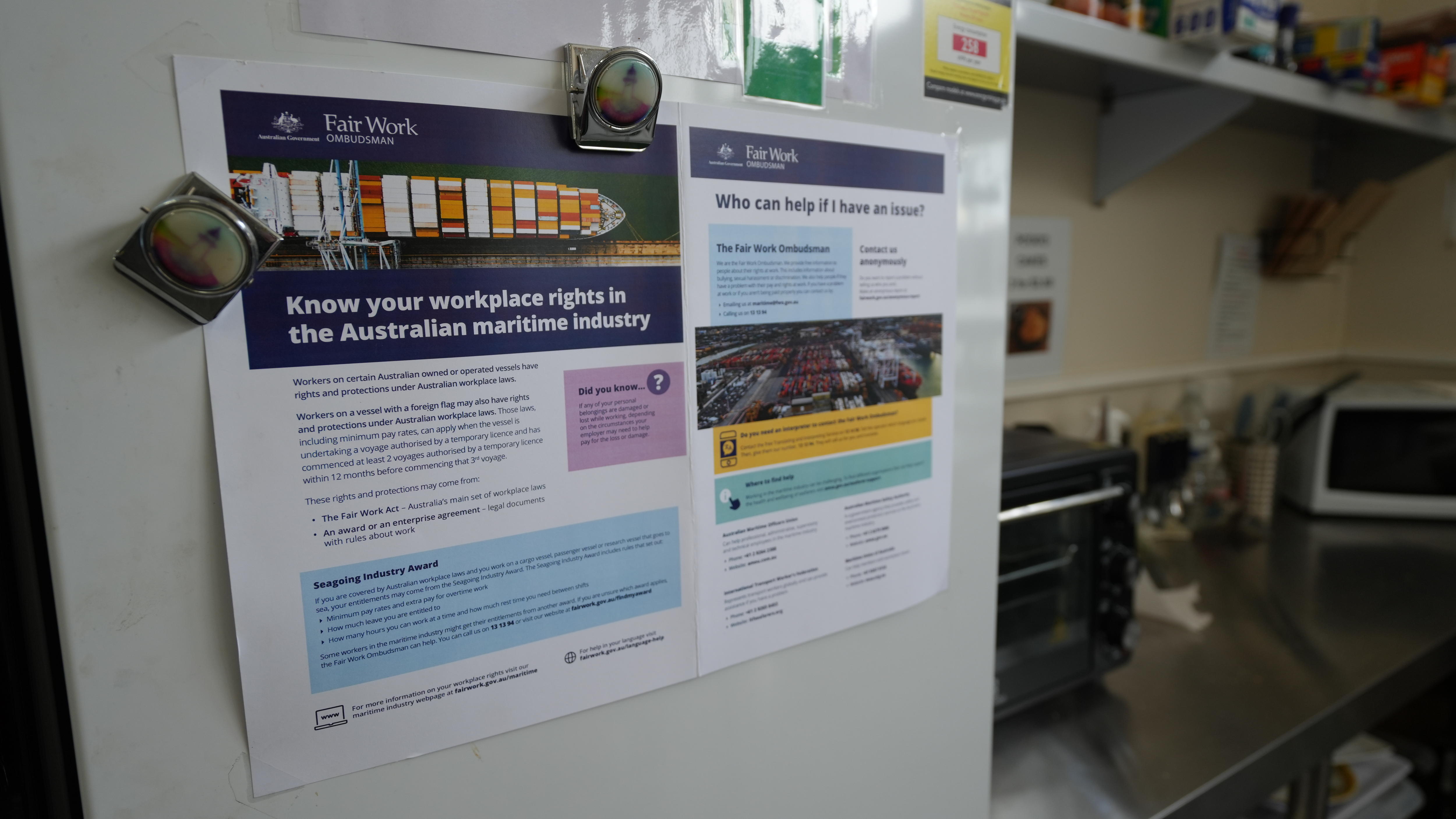 A poster stuck to a kitchen fridge about seafarer workers rights.