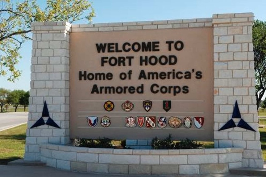 A sign reading 'welcome to Fort Hood, home of America's Army Corps'