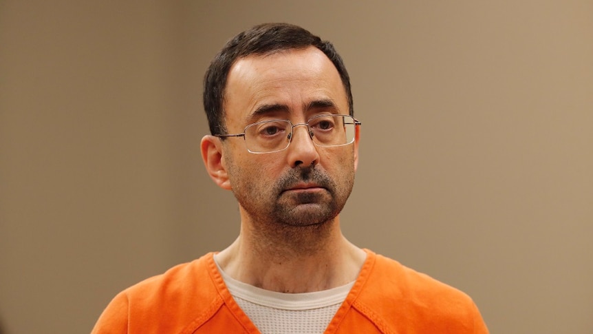 Larry Nassar in court wearing an orange prison uniform.