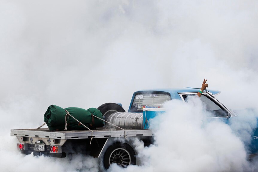 Burning rubber during the National Burnout Masters on the final day of the Summernats.