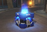 A loot box in video game Overwatch glows with light before being opened.