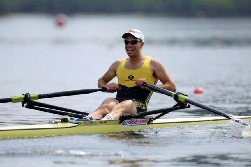 Tim Smith, wearing green and gold, rows for Australia