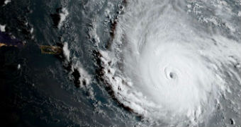 A hurricane whirlwind is seen from a birds-eye view as it makes its way across the ocean.