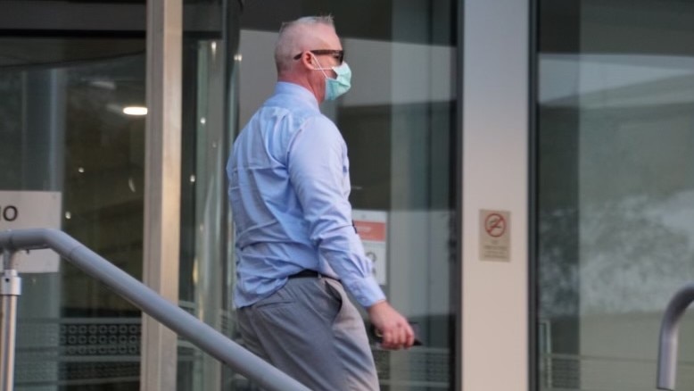 Cleve Pain wearing a COVID mask outside court.