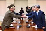 South Korea officials shake hands with North Korea