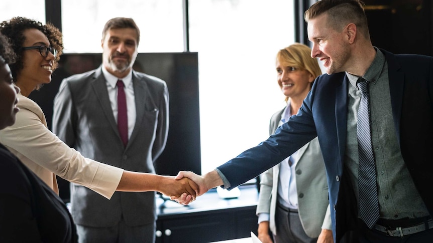 People shaking hands after interview