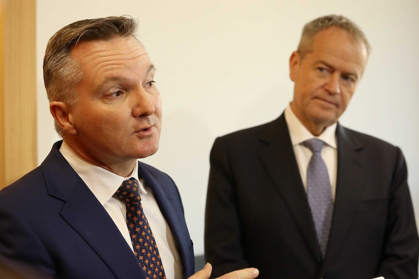 Chris Bowen addresses the media with Bill Shorten looking on