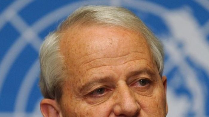 Philip Ruddock gestures while speaking during a press conference.