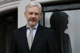 WikiLeaks founder Julian Assange speaks from the balcony of the Ecuadorean Embassy