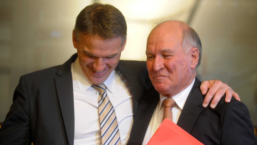 Rob Oakeshott and Tony Windsor embrace after both announced their retirement from politics.