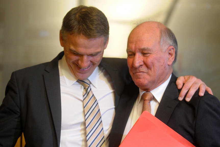 Rob Oakeshott and Tony Windsor embrace after both announced their retirement from politics.