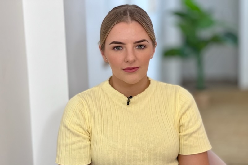 Mid shot of Lorna Zelenak wearing a yellow top