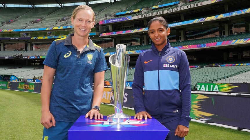Australian and Indian captains stand with the trophy ahead of the Women's T20 World Cup final.