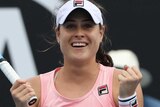 Kimberly Birrell pumps her fists and smiles to the crowd after beating Donna Vekic at the Australian Open