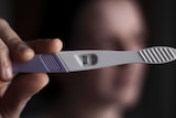 Woman with her pregnancy test equipment
