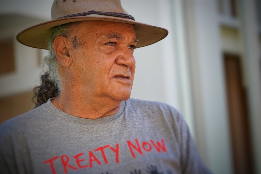 Vincent Forrester wears an Akubra and Treaty Now t-shirt.