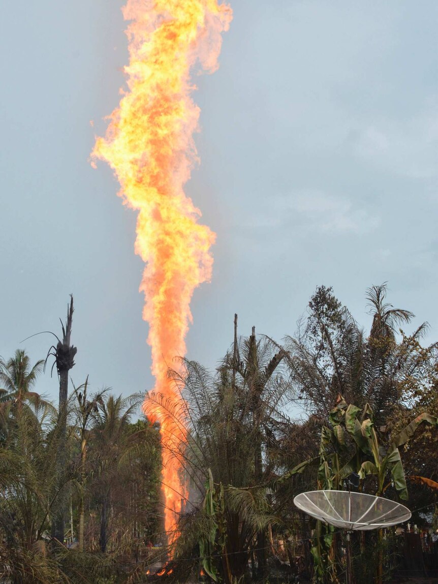 A large jet of fire from an oil well