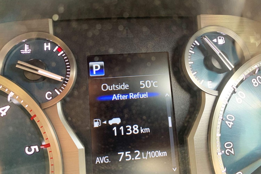 Dashboard display in car reads 50C as it is driven into Birdsville on Christmas Eve.