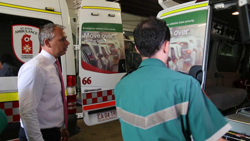 Chief Minister Adam Giles meets with officers at the Casuarina ambulance station after a new funding agreement was announced.
