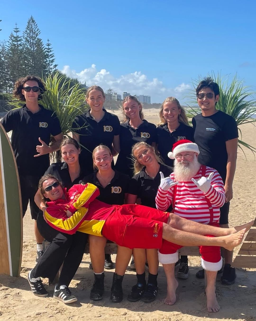 Ms Day sits amoungst colleagues at a Christmas celebration.