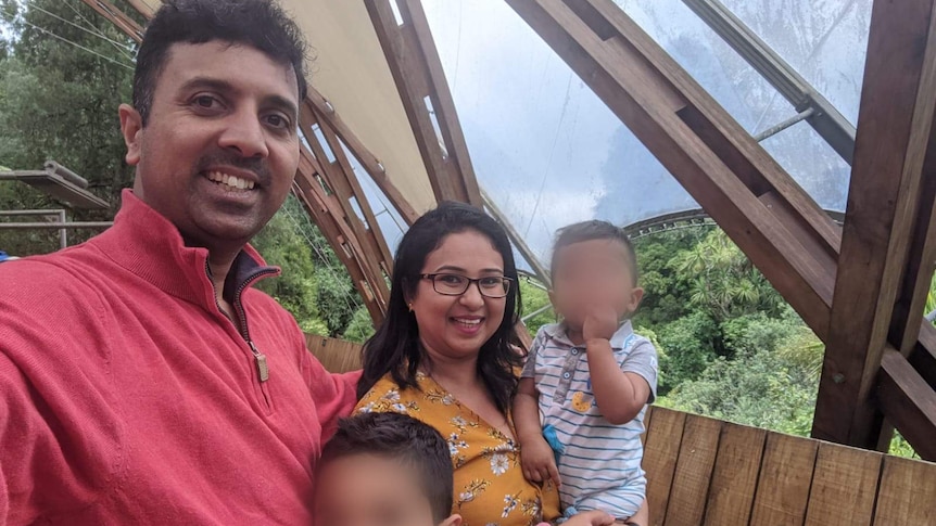 Srihari Ramadas and his family smiling at the camera