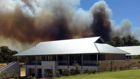 Smoke rises above the Peter Carnley Anglican Community School in Kwinana