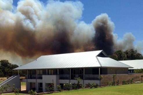 Smoke rises above the Peter Carnley Anglican Community School in Kwinana