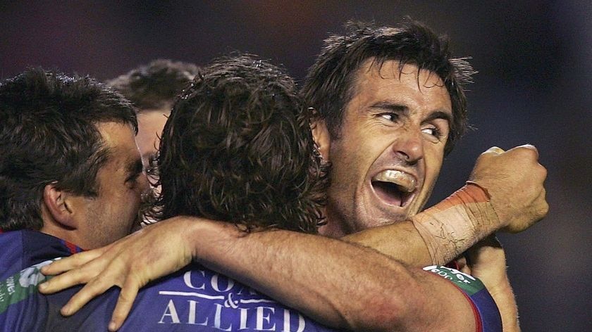 Career over ... Andrew Johns celebrates with the Knights during the 2006 finals series