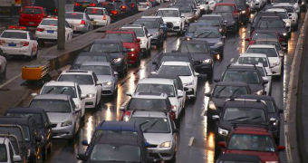 Five lanes of traffic jams with cars tightly packed across all lanes of major road.