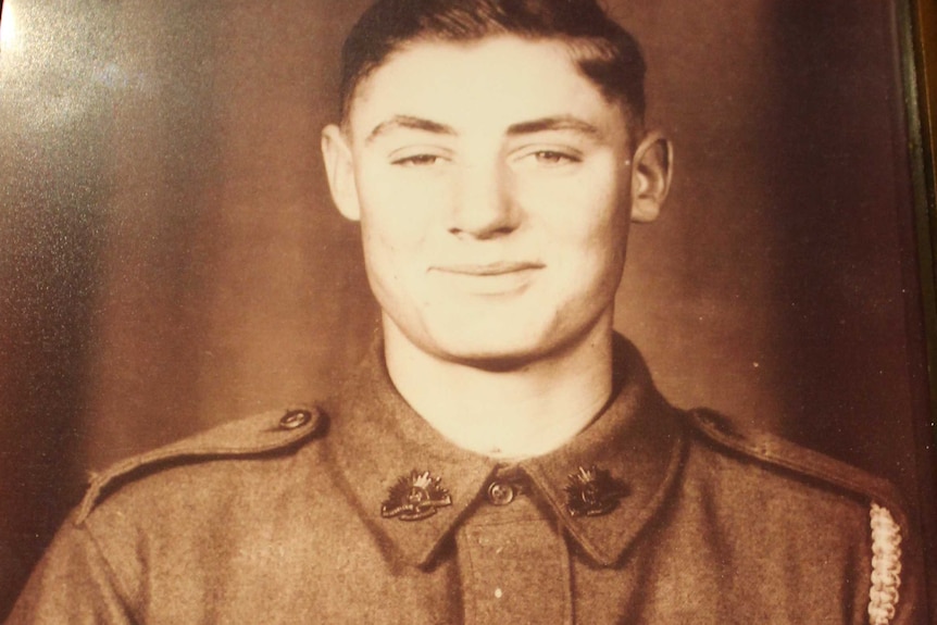 A portrait of World War II veteran Andy Bishop in uniform as a 16-year-old soldier.