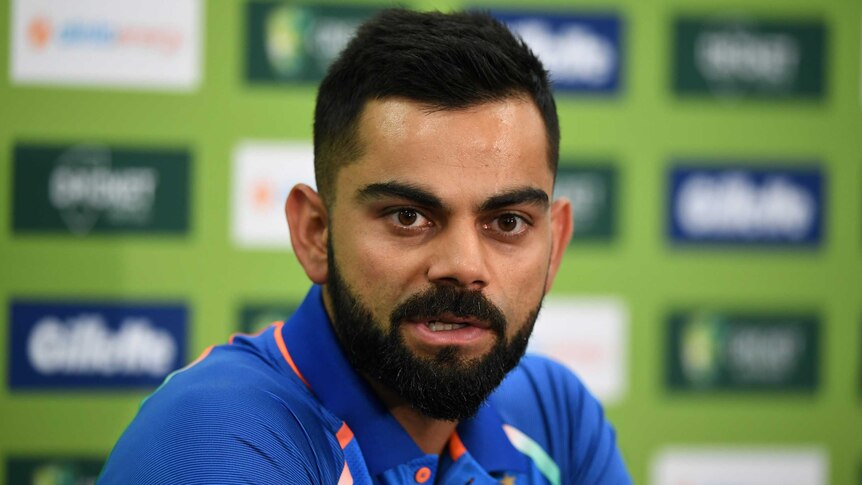 Indian cricket captain Virat Kohli speaks while sitting at a table at the SCG.