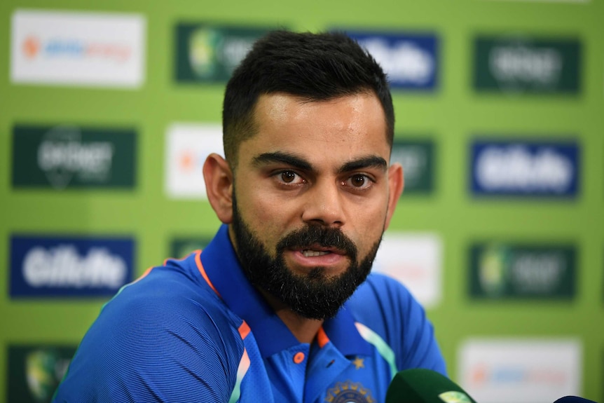 Indian cricket captain Virat Kohli speaks while sitting at a table at the SCG.