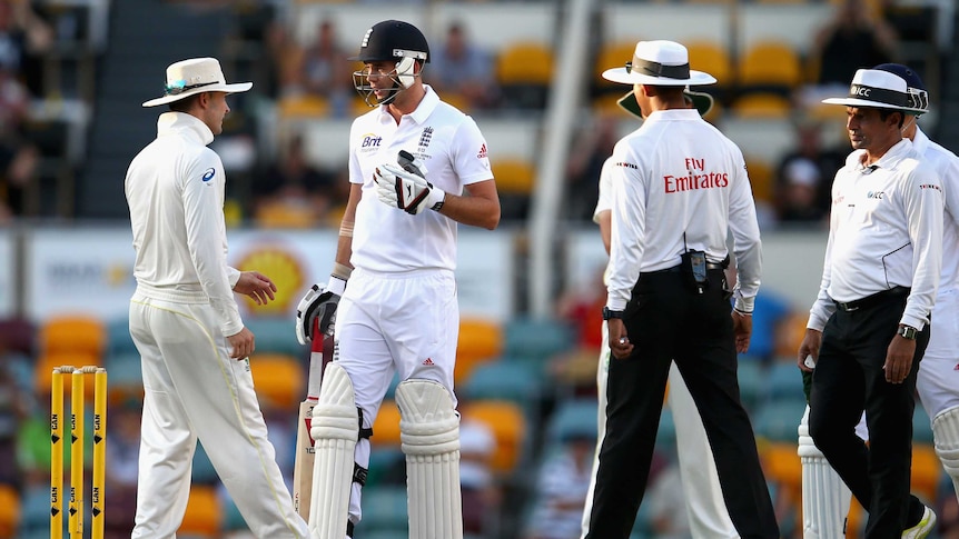 Australia's Michael Clarke and England's James Anderson exchange words on day four at the Gabba.