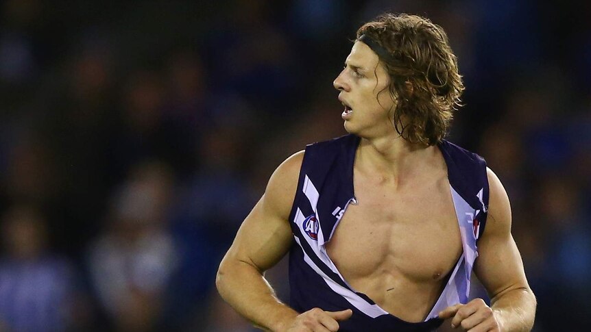 Nat Fyfe with his shirt ripped