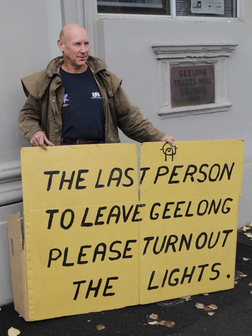 A Geelong Ford worker of 39 years gets his point across outside a meeting where Julia Gillard met with workers in Geelong.