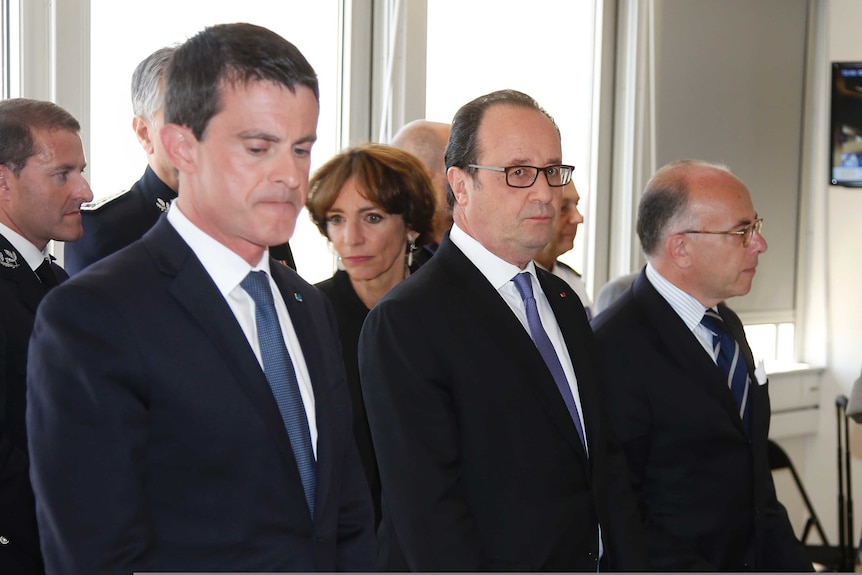 French President Francois Hollande with his prime minister Manuel Vallas and interior minister Bernard Cazeneuve.