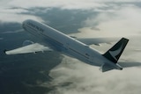 Cathay Pacific plane flying in clouds.