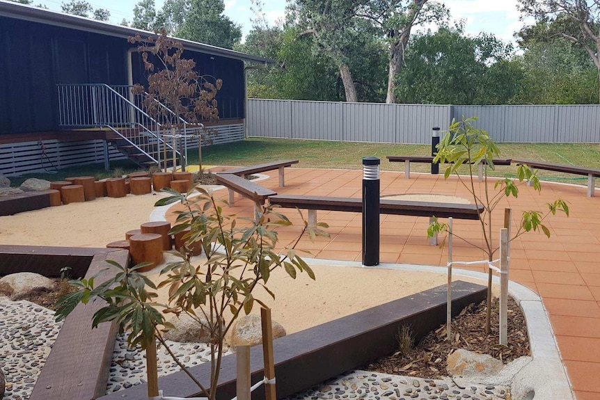 Yard of building with paved sitting area