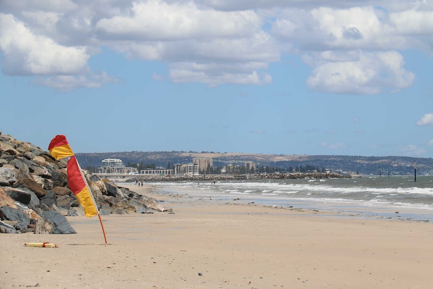 West Beach, in Adelaide, South Australia, with lifesaving flags in the sand