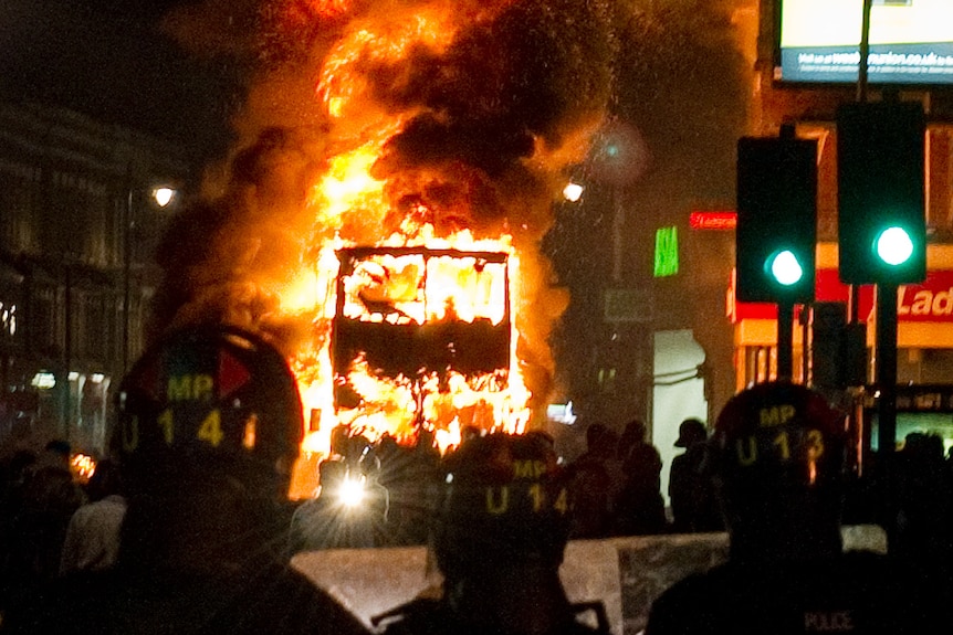 Bus burns in Tottenham riot (AFP: Leon Neal)