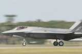A F-35A Joint Strike Fighter touches down at its new home base at Williamtown, north of Newcastle in New South Wales.