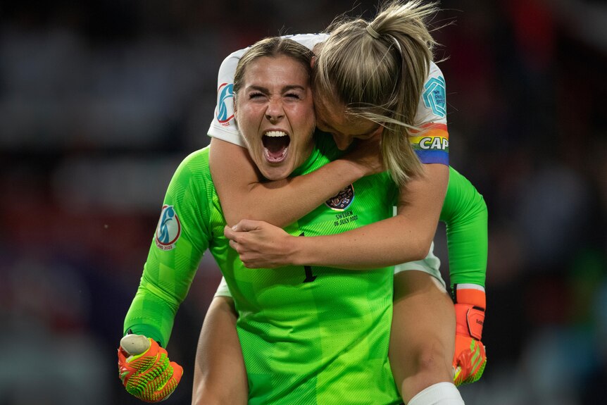 Leah Williamson jumps onto Mary Earps' back as they celebrate a goal against Sweden in the semi-final of the 2022 Euros