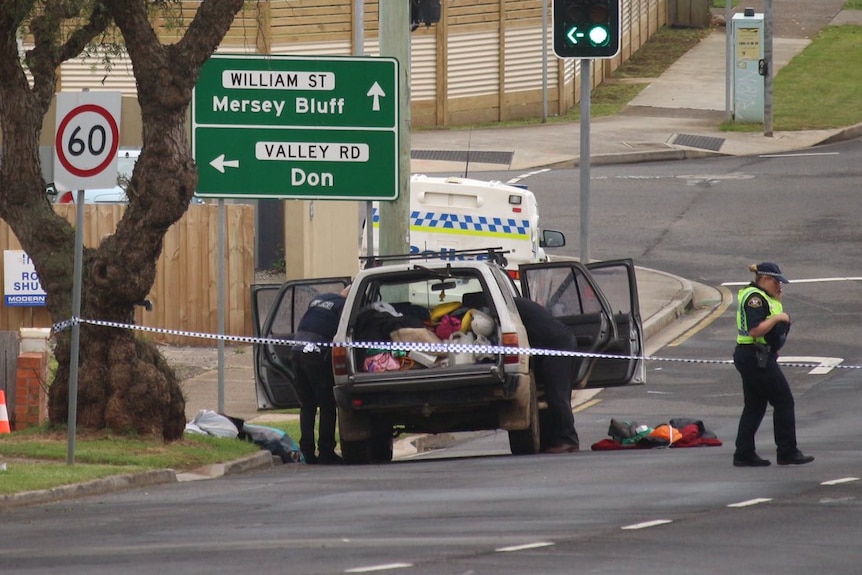 Tasmania Police attending a crime scene.