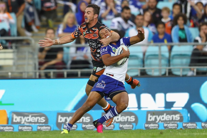 Justin Hunt goes very high on Moses Mbye