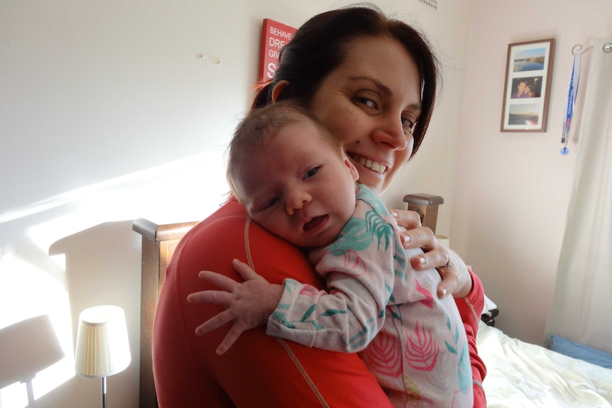 Dr Sarah Perkins Kirkpatrick and her baby
