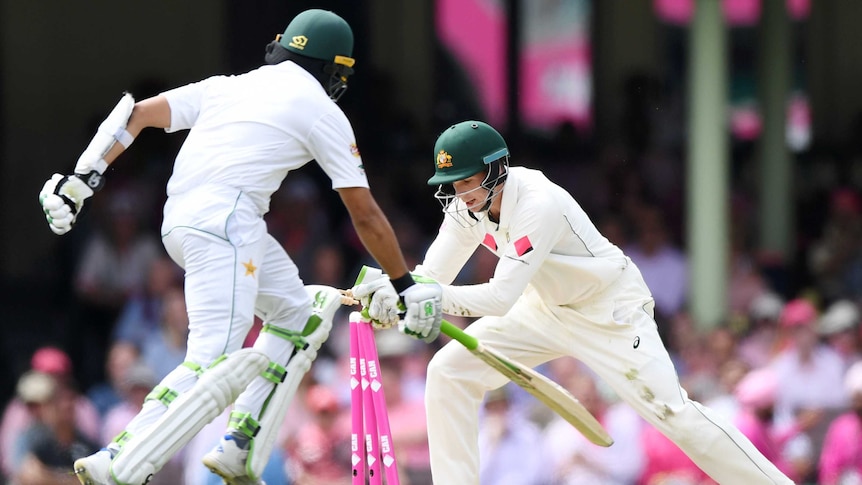 Peter Handscomb whips the bails off to complete a run out