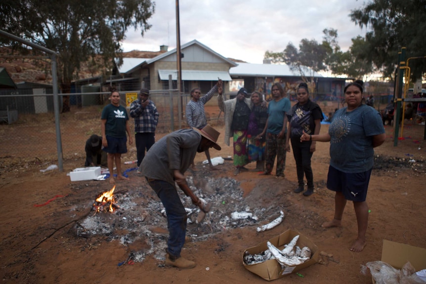 A remote community prepares to barbecue kangaroo tails