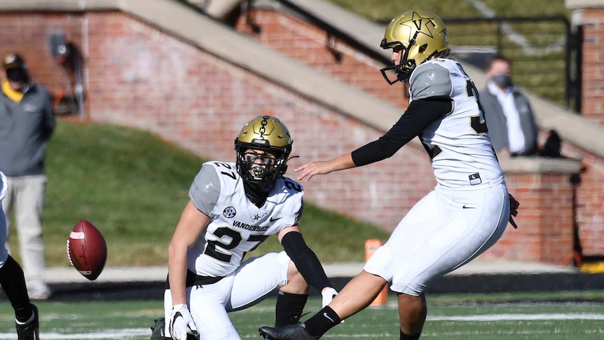 Vanderbilt kicker Sarah Fuller kicks the ball out of the hold off Ryan McCord to start the second half of against Missouri.